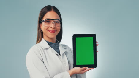 Scientist-woman,-tablet-and-green-screen-in-studio