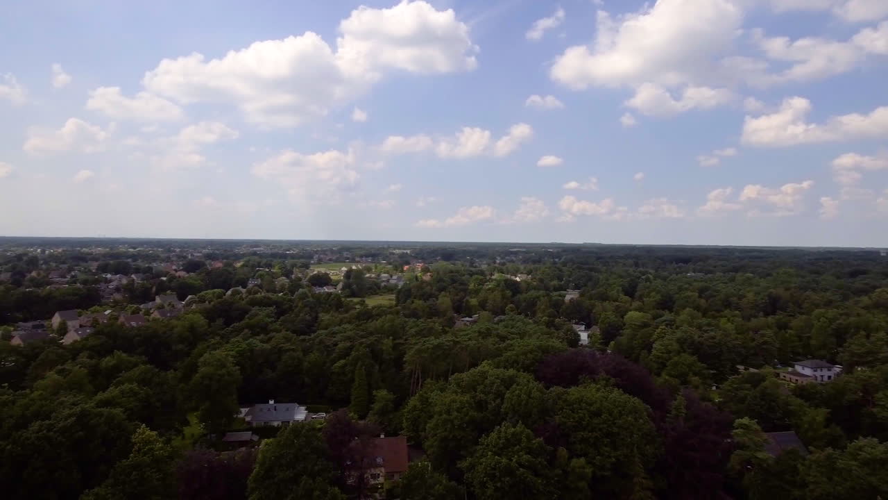 A drone flight over the Kempen forest and village in Belgium near to Antwerp