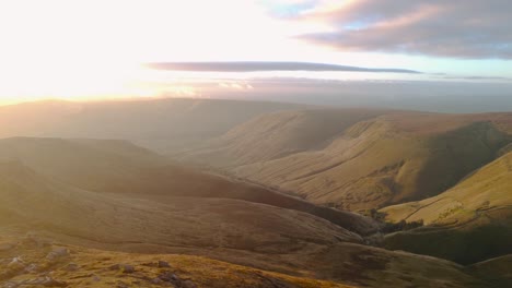 early morning golden hour sunset downhill at peak district kinder scout