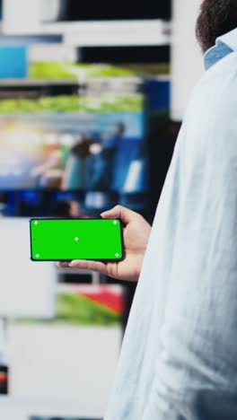 vertical video focused person connecting on social platforms next to mockup screen