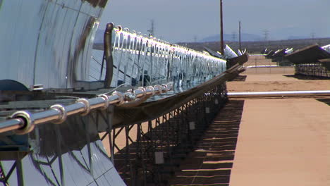 banks of solar panels reflect in the hot sun