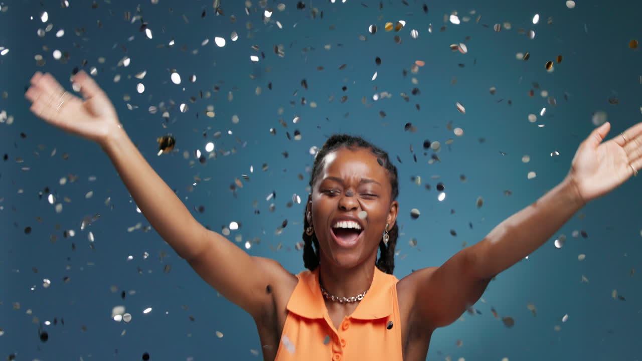 Woman celebrating with confetti