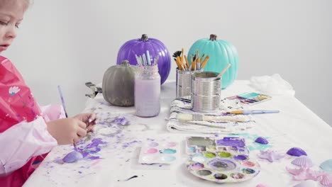 painting craft pumpkin with acrylic paint