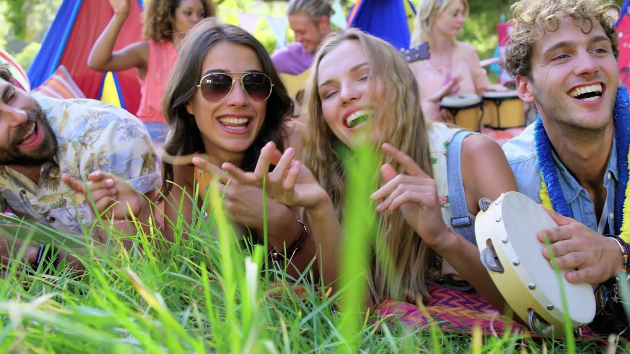 Group of Friends Having Fun and Using Smartphones Outdoors
