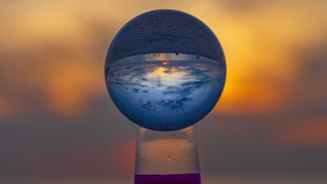 sunrise inside the crystal ball on the beach