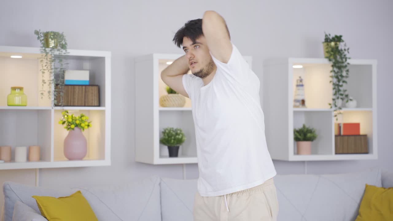 Man yawning left and right. home sport.