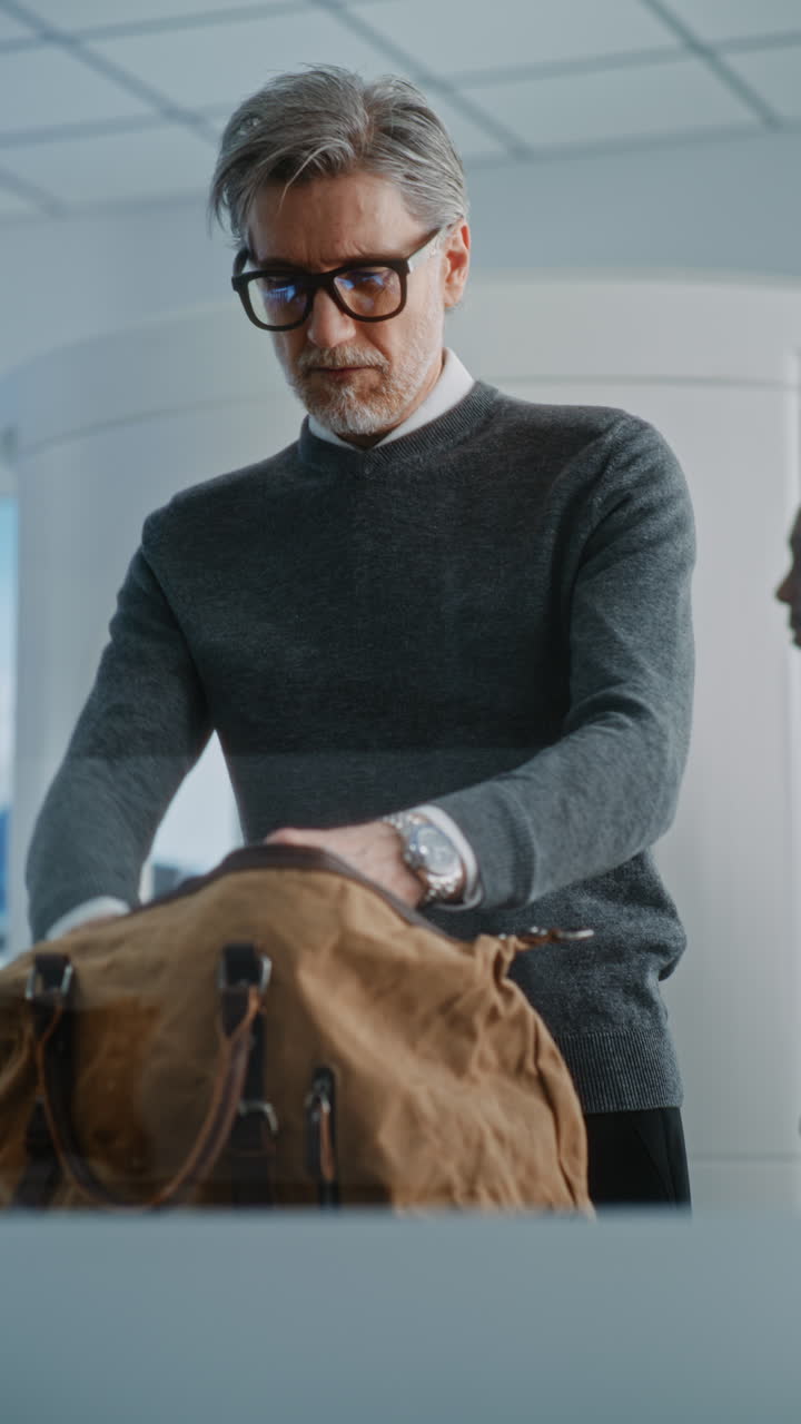 Man Checking Luggage at Airport