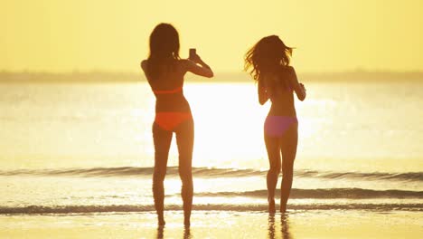young african american asian chinese girls on beach