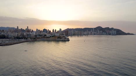 Sunset-over-Coastal-City-of-Benidorm,-Spain---Beautiful-Aerial-Drone-View