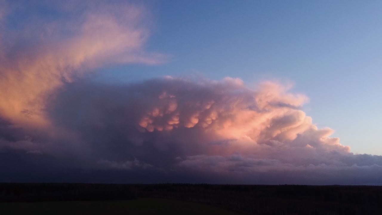 Autumn storm cloud mammatus time lapse from drone sunset light sky