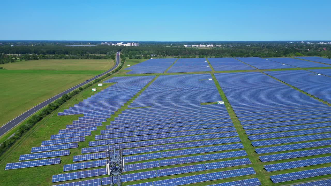 5g Telecommunication tower in a huge solar panel plant in Germany, capturing the convergence of technology and sustainability. Beautiful aerial view flight panorama overview drone