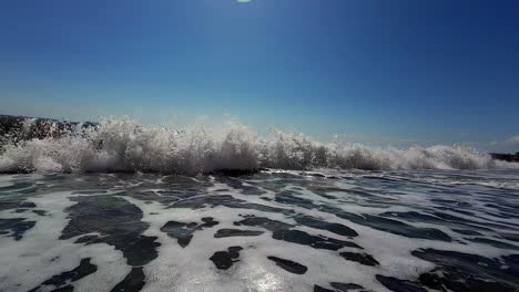 Exotic-wave-crashing-on-sunny-day,-close-up-view