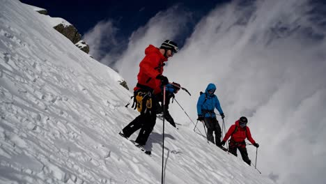 mountain climbers ascending a snowy slope