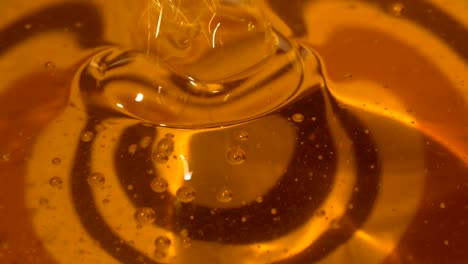 pouring honey. close-up of honey dripping