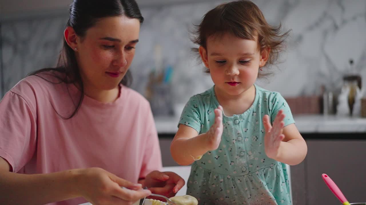 A Heartwarming Baking Moment Between Mother and Daughter: Creating Memories and Delicious Treats Together in the Kitchen, Filled with Joy and Laughter