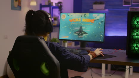 winner gamer sitting on gaming chair at desk