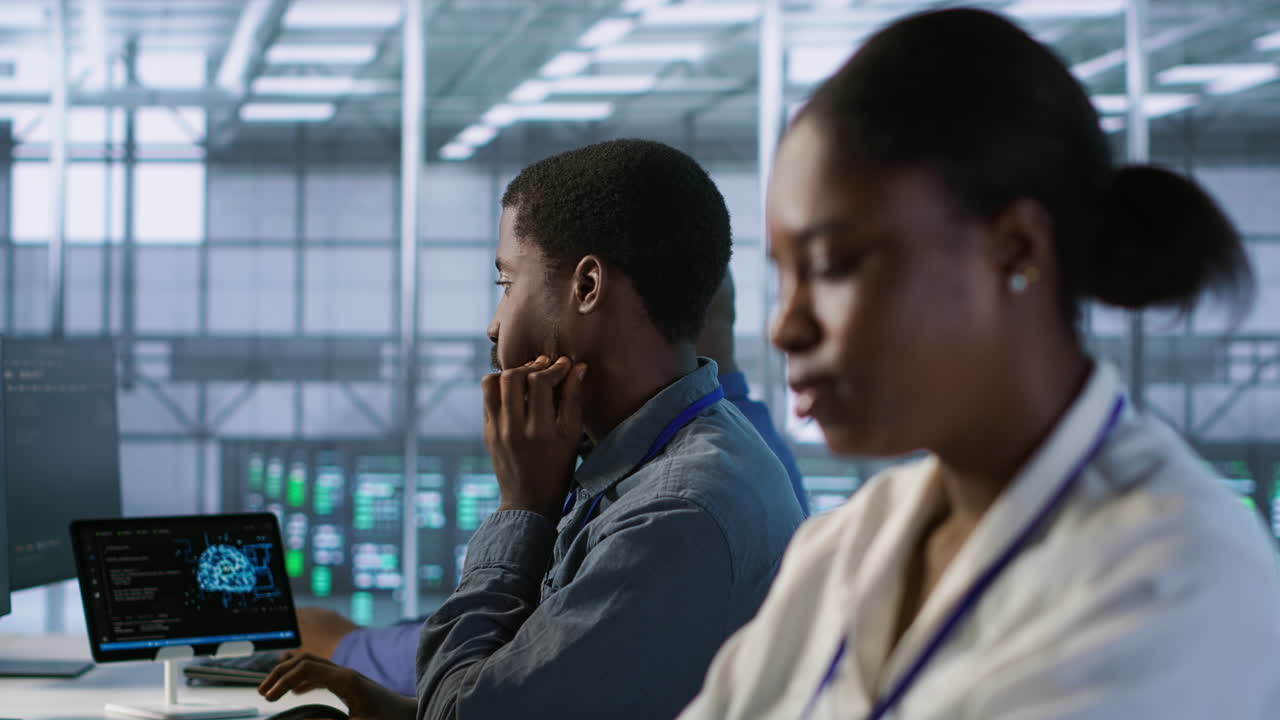 Diverse Team Working in a High-Tech Control Room