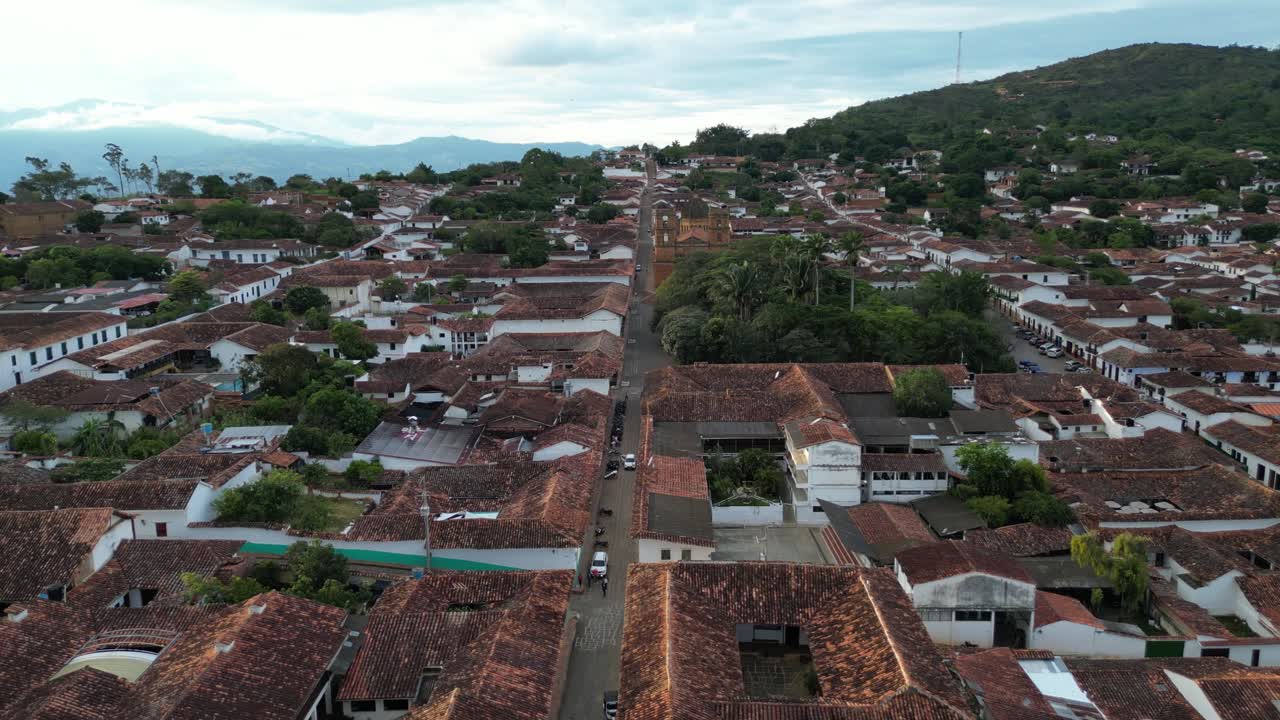 Aerial view of the Andean village of Barichara in the Santander Department of Colombia, featuring colonial clay houses, red-tiled roofs, cobblestone streets and La Inmaculada Concepción church