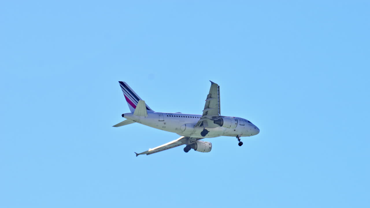 Plane flying in the cloudy, grey sky