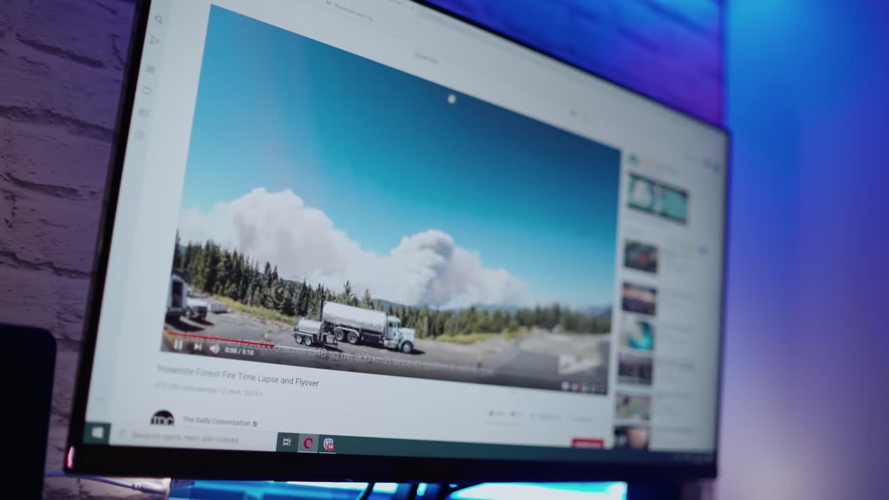 Screen of a modern computer. Video film about ecological disaster on the monitor. Close-up.