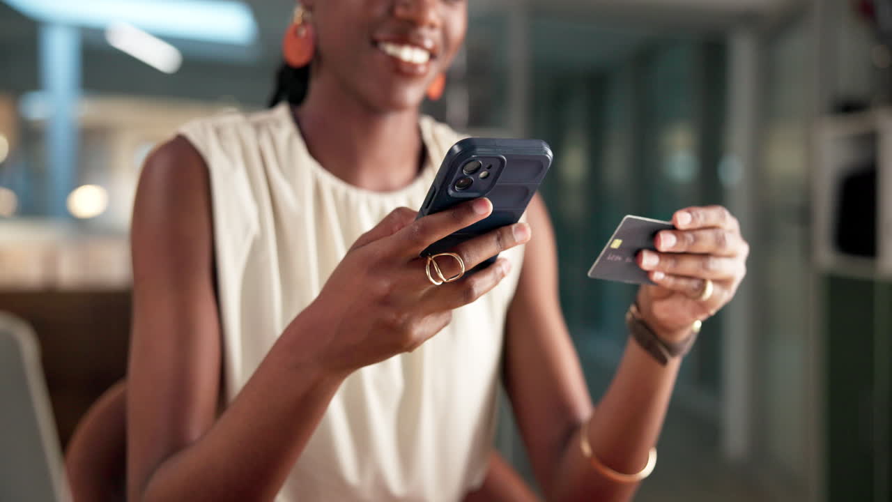 Happy Woman Making Online Purchase with Smartphone and Credit Card