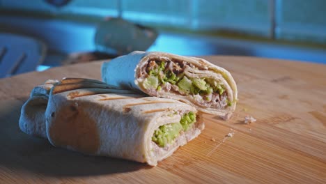 rack focus on anabolic tuna wrap with broccoli