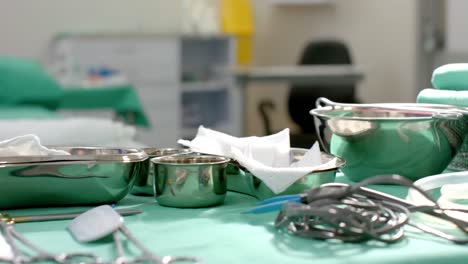 close up of surgical instruments on table in operating theatre at hospital, slow motion