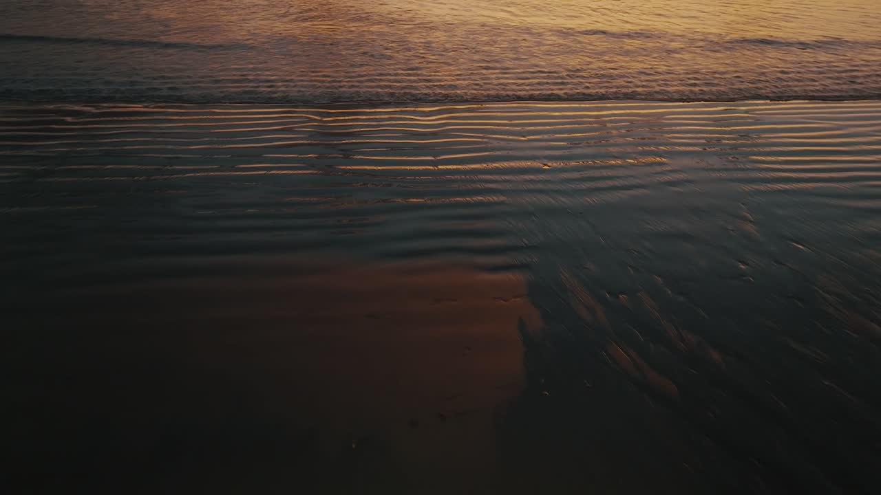 Sea Waves Illuminated By The Golden Sunset In Guanacaste, Costa Rica - drone shot