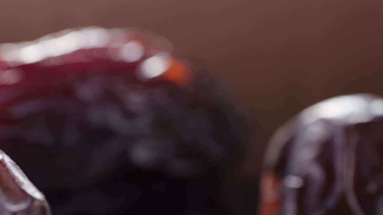 Close-up of Dates on Metal Skewers