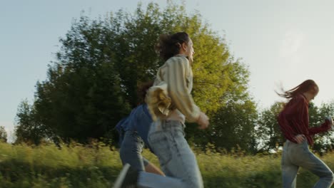 friends running through a field