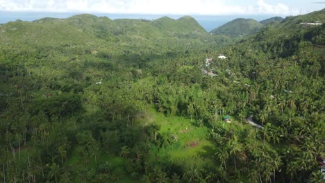 a flight over a little village on the mountains in the philippines