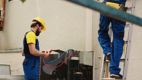 Colleagues-checking-HVAC-system