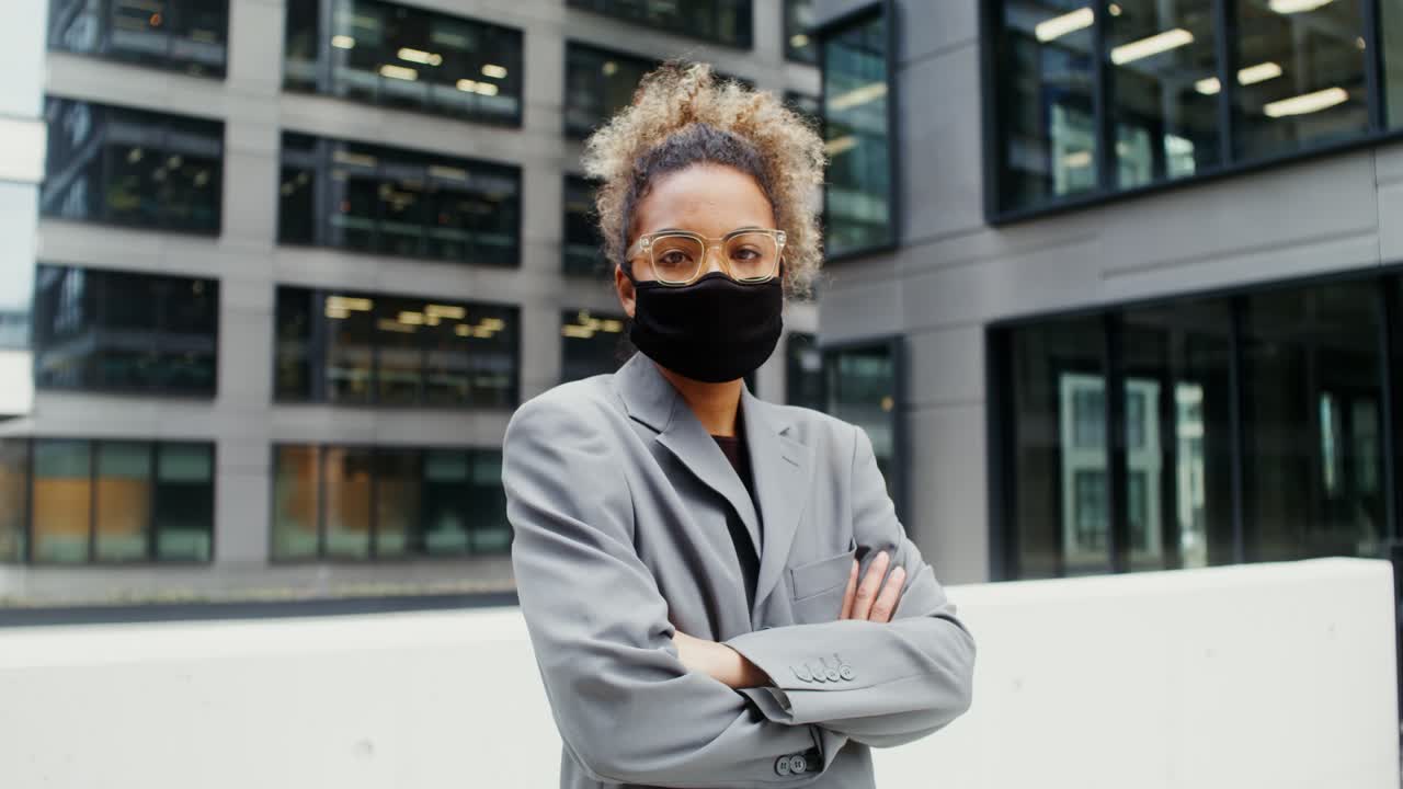 Businesswoman Wearing a Mask in a City