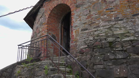 a view of an ancient fortress museum at korela in russia, gate, and staircase