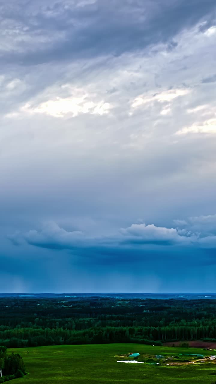 Dramatic sky with gathering storm clouds moving timelapse in a rural field