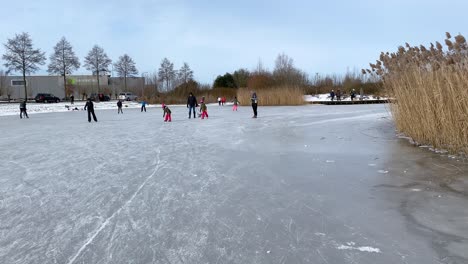 people enjoy ice skating on a frozen pond in winter