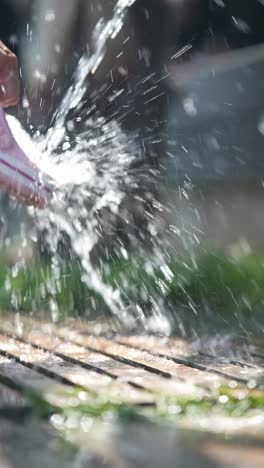 washing pink shoes in the garden