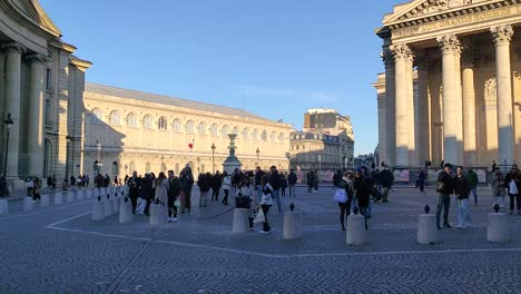 people gather in front of the historic pantheon in paris, france