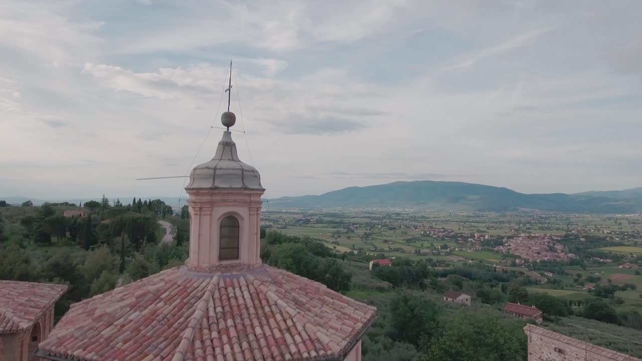 Aerial Drone shot Crane Up from Church and Hold Shot on Countryisde in Umbria, Italy