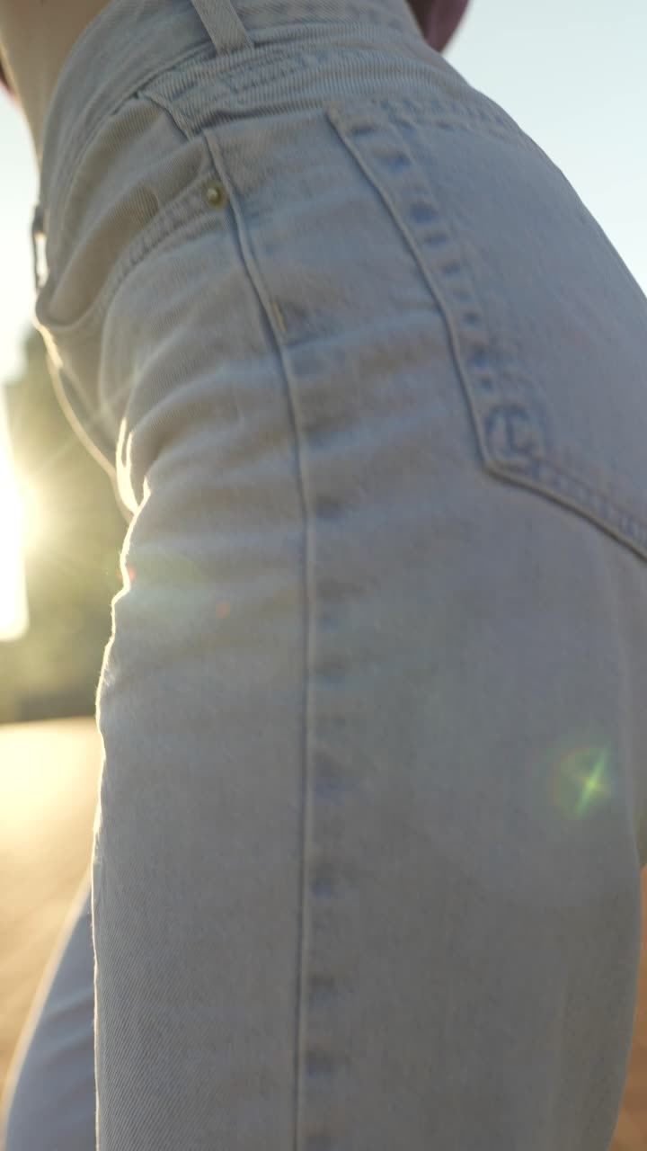 Woman in jeans and purple shirt