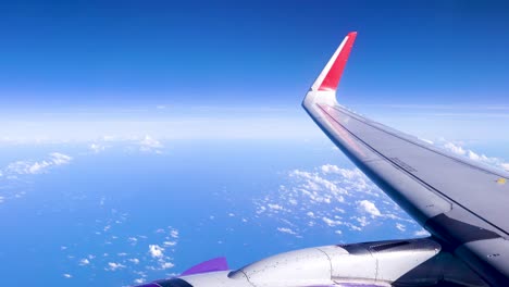 bright and beautiful blue sky landscape, higher floating movement cloud, airplane window and engine, amazing vacation scenery