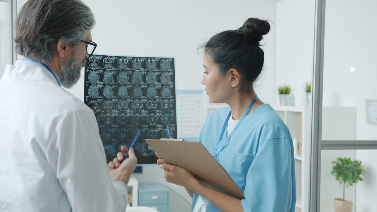 Doctor and Nurse Reviewing Medical Images