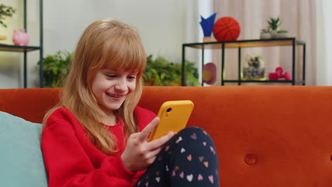 young child kid girl texting share messages content on smartphone social media applications online