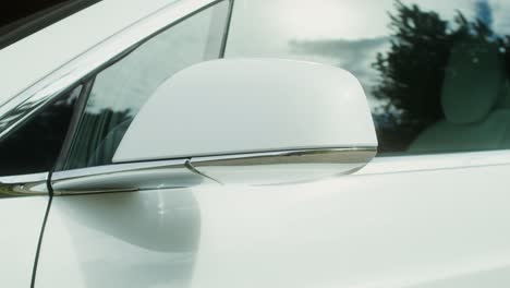 close-up of a white car side mirror