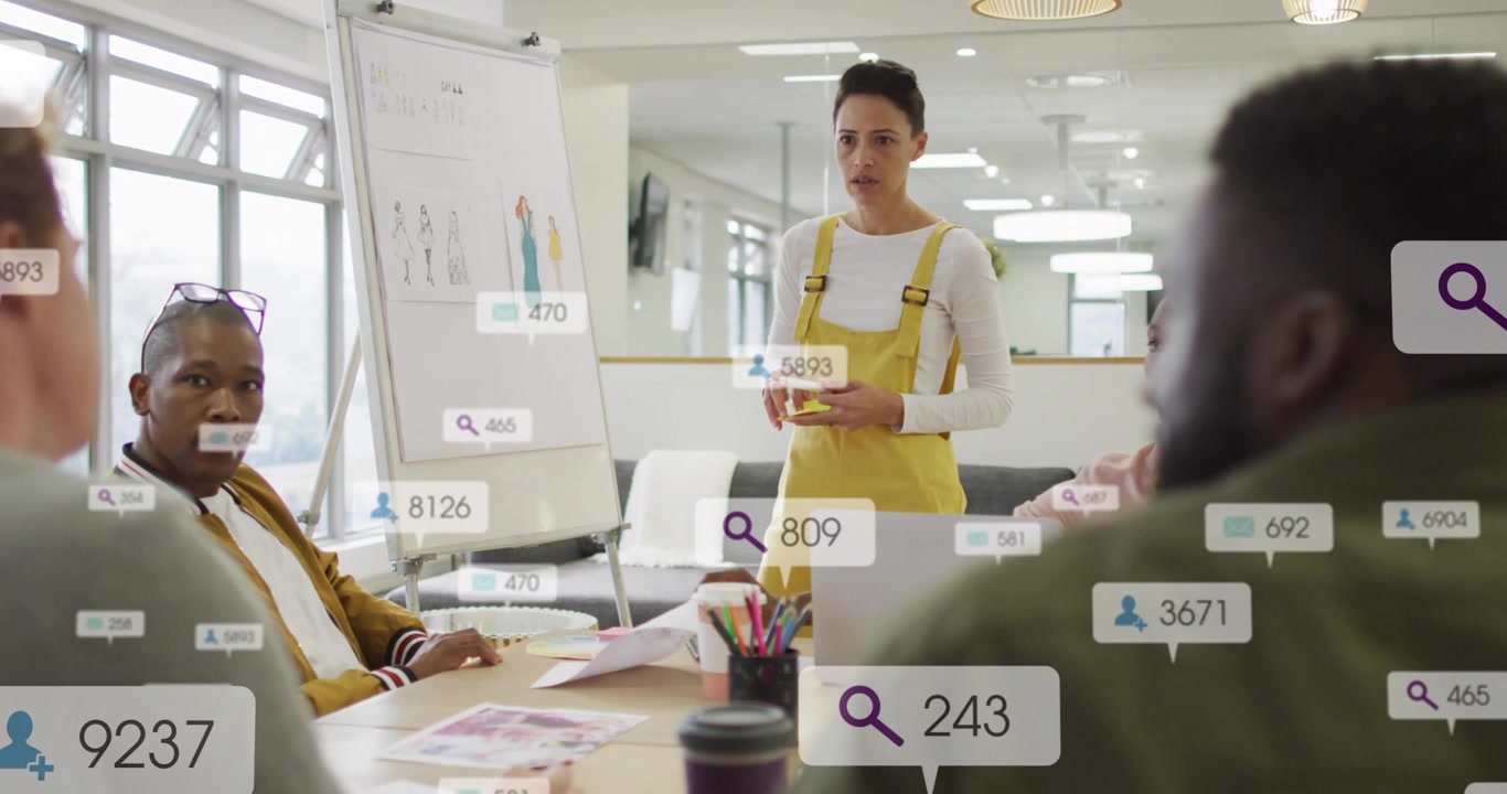 Presenter gesturing at sketches in fashion presentation as metrics icons rising, showing growth