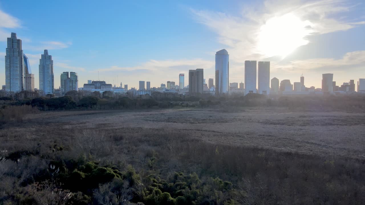 4K Aerial Drone Footage Slow Low Flying Over Nature Reserve in Puerto Madero with Cityscape Skyline and Beautiful Sunset Over Architectural Modern Buildings in Buenos Aires, Argentina