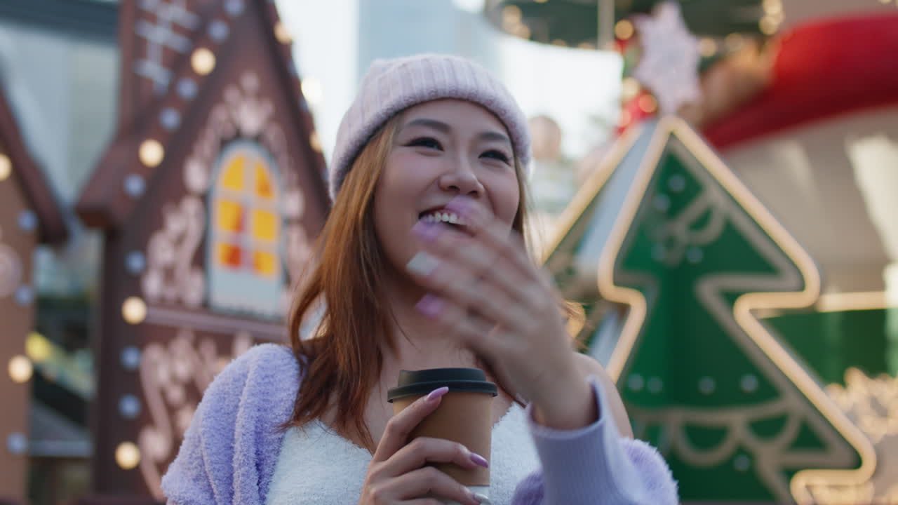 Smiling woman in winter clothes at a Christmas market