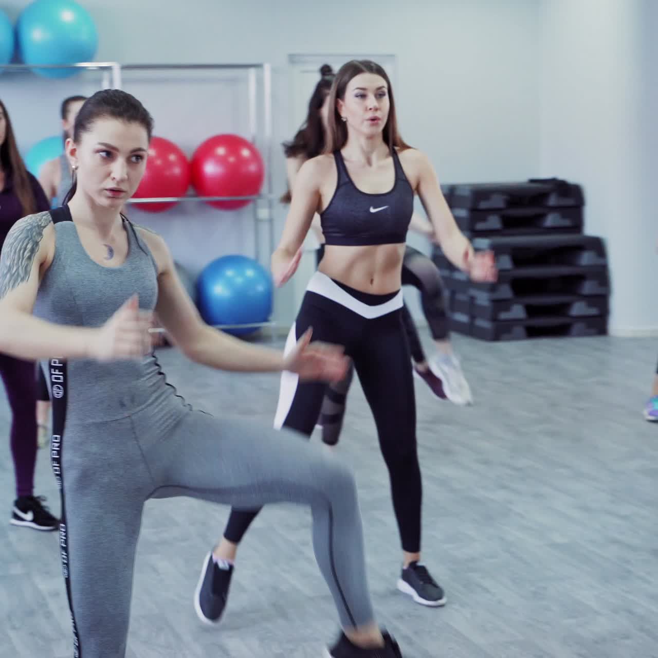 People at gym in aerobics class