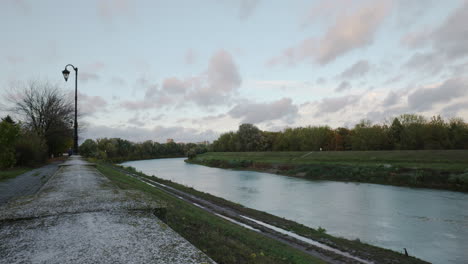 riverside walkway at sunset in windy weather