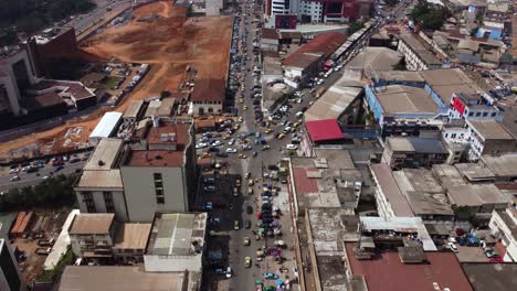 Yaounde-City-Streets-and-Building-Rooftops-in-Developing-Country-of-Cameroon,-Aerial